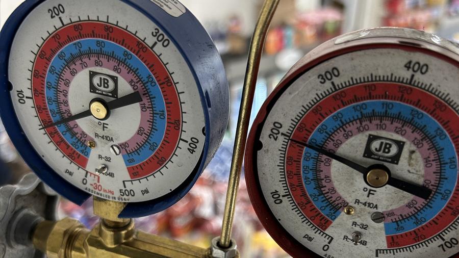 Refrigerant manifold gauges reading pressures on an R-410A system