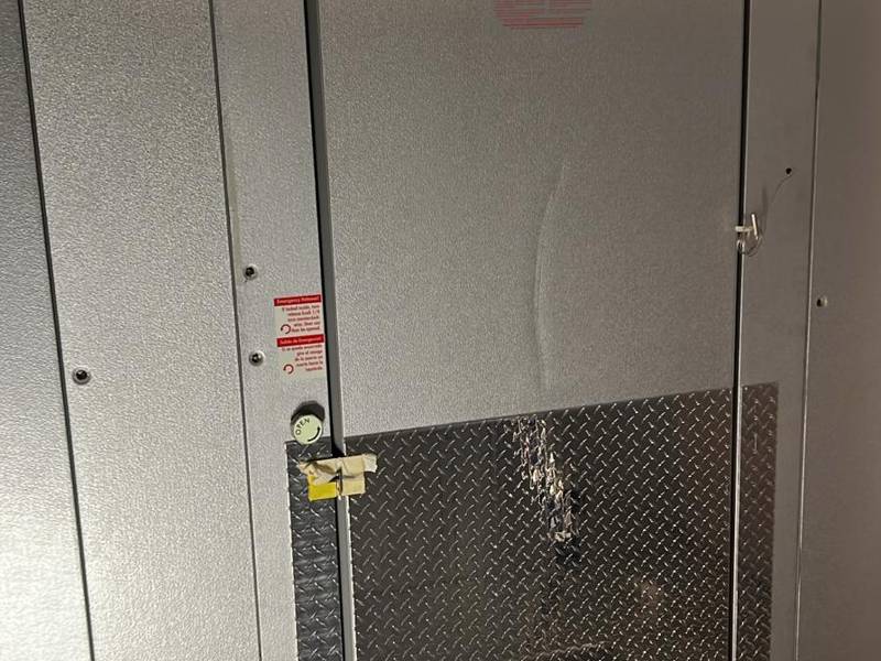 Walk-in door with kick plate and safety release