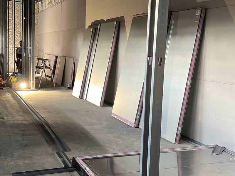Walk-in panels lined up along the new kitchen wall