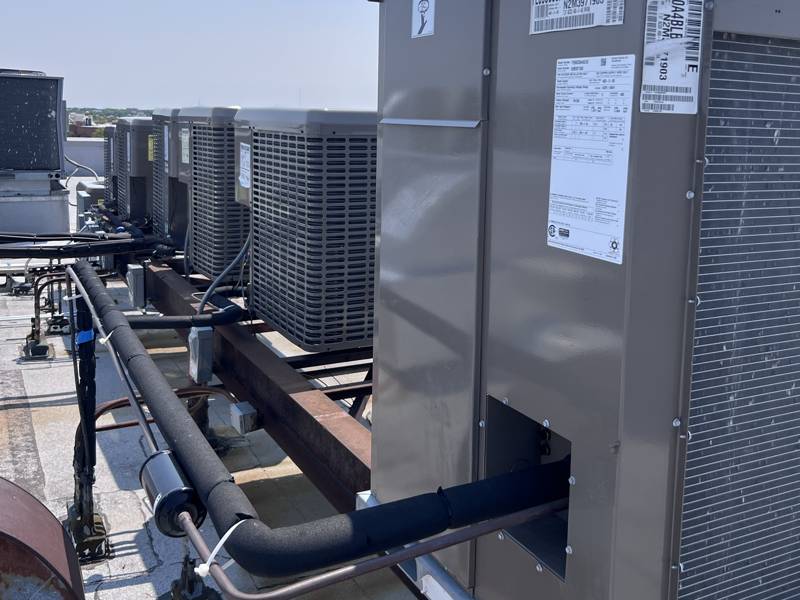 New rooftop unit and condensers on a shared rack